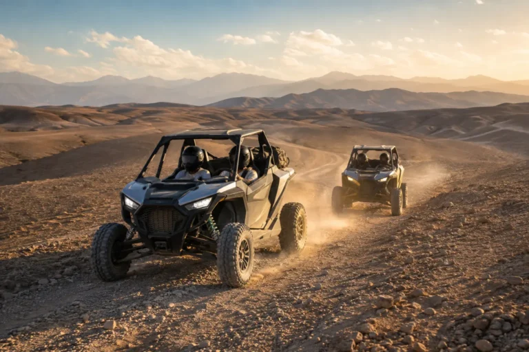 Helmeted travelers driving buggies in the Agafay Desert